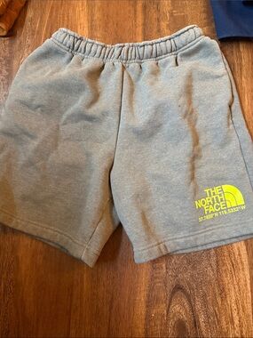 The North Face Men's Gray Fleece Shorts with Yellow Logo
